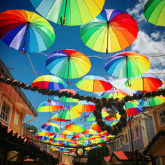 colorful umbrellas on a background of blue sky