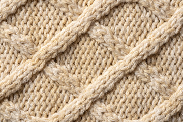 Beige Knitwear Fabric Texture with Pigtails. Beige Knitted Background.