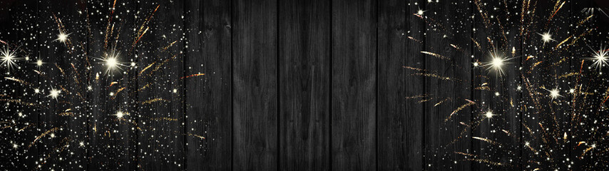 Silvester background panorama banner long - Firework on rustic dark black wooden texture with space for text