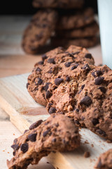 Chocolate chip cookies on a wooden background with milk. No people. Concept raw food. Front