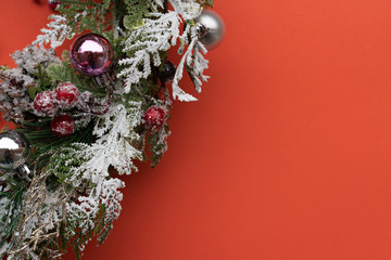 Christmas orange background with fir wreath. Xmas magic background.