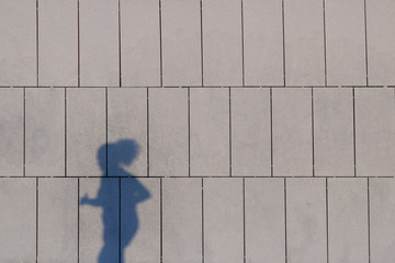 Shadow of people projected on the bus station of Pamplona, Spain