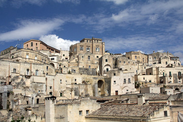 Fototapeta na wymiar Matera, Italy - 07/16/2017: The historic center of the city of Matera, which is included in the UNESCO World Heritage List.