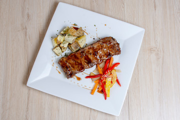  caramelized baked rib, potatoes and salad