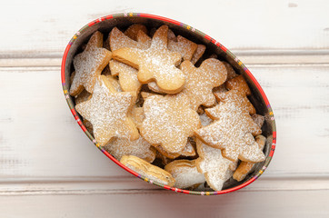 gingerbread christmas cookies in the box on white wooden boards