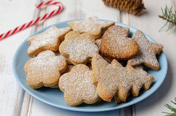 gingerbread christmas cookies in the box on white wooden boards