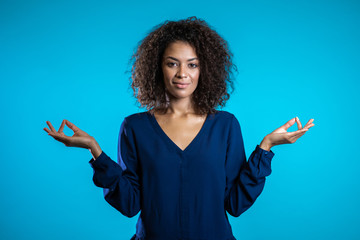 Calm student girl or businesswoman relaxing, meditating. Woman calms down, breathes deeply with...