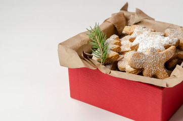 gingerbread christmas cookies in the box on white wooden boards