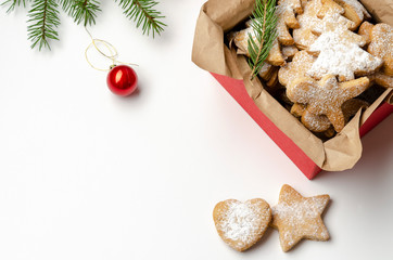 gingerbread christmas cookies in the box on white wooden boards