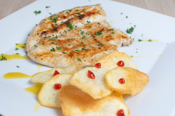  grilled chicken breast and french fries