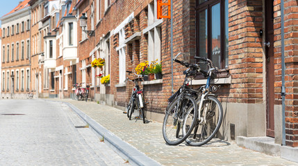 Bicycles at ancient building facade, European town