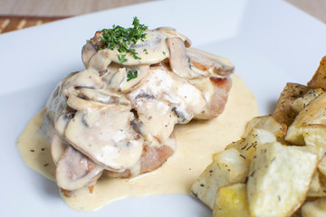 meat in mushroom sauce and french fries