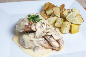 meat in mushroom sauce and french fries