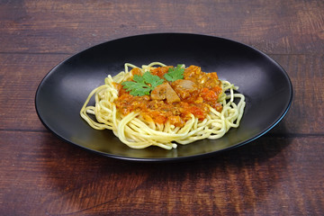 Spaghetti in sauce with chicken.