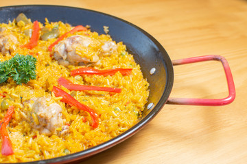  Traditional Spanish paella with different meat, seafood and vegetable ingredients