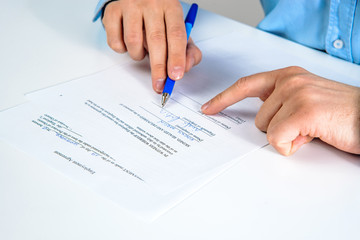 Signing contract. Business concept, hiring employees. The man signs the contract, signs the employment contract. Signature of the commitment.