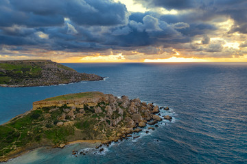 Ghajn Tuffieha Bay. Aerial view landscape. Sunset sky, clouds, sea, winter. Europe. Malta island