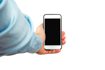 Phone in hand on a white background. A man holds a phone with a blank display in his hand. The concept of supplementing content, providing information.