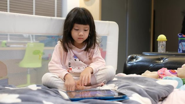 chinese child addicted phone, asian girl playing smartphone, kid use telephone, watching cartoon