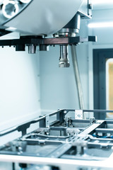 CNC lathe machine cutting slot with milling turret.