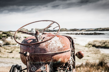 Old Rusty Tractor in a beach setting in Tasmania  