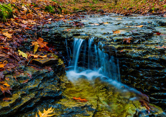 McConnell Mills State park waterfalls in autumn in color  hell's hollow