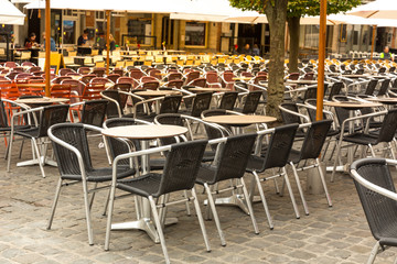 Street cafe and ancient building facades, Europe