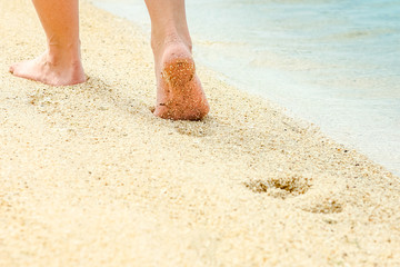 beautiful footprints in the sand by the sea background
