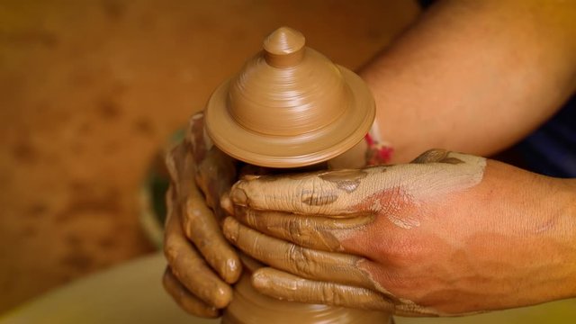 Potter at work makes ceramic dishes. India, Rajasthan.