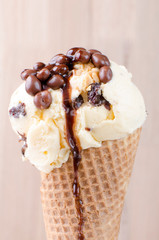  ice cream cone, with fruit and chocolate flavors