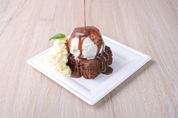 brownie with ice cream in chocolate sauce