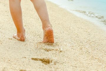 beautiful footprints in the sand by the sea background