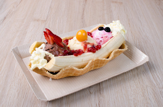 Banana Split With Chopped Fruits And Sauces