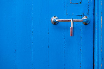 Blue pastel beautiful interior door with metal lock