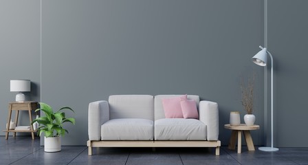 Mock up wall in living room with sofa, plants and table on empty dark wall background.