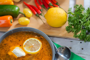 plate with solyanka with vegetables on the table