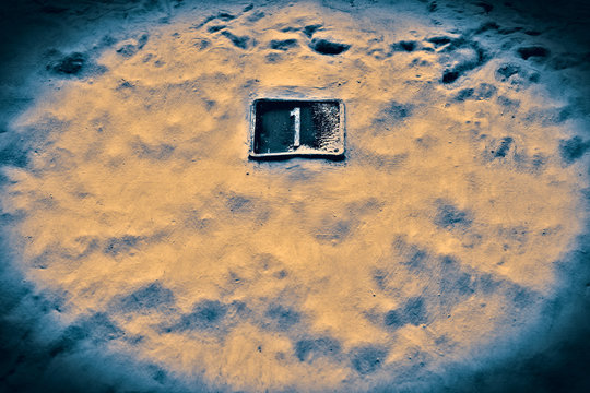 Number 1, one, plate on a wall - image with split toned effect and vignette added.