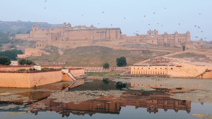 Amer Fort is a fort located in Amer, Rajasthan, India. Located high on a hill, it is the principal tourist attraction in Jaipur.