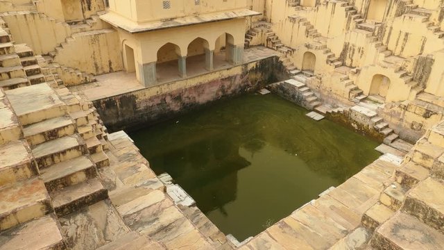 Jaipur Stepwell. Stepwells are wells or ponds in which the water is reached by descending a set of steps to the water level.