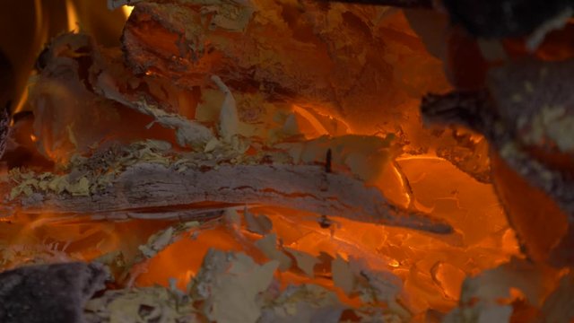 Hot embers in a fire place with wood burning