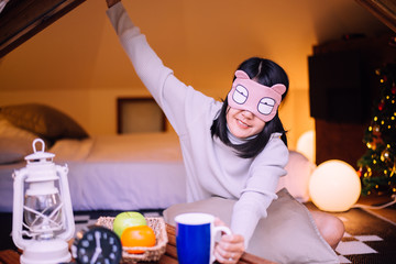 Beautiful asian woman stretching in tent after wake up in the morning,Happy and smiling,Relaxing time
