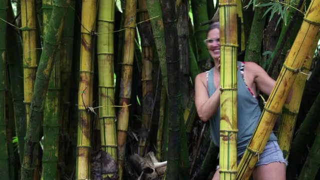 Woman Walking Through Bamboo Forest