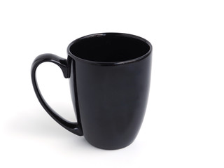 Empty black mug for coffee or tea isolated on white background.