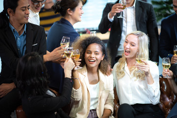 A group of working people are hanging out celebrating New Year's holidays and Christmas.