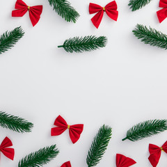 Fototapeta na wymiar Christmas tree branch and red bow decoration