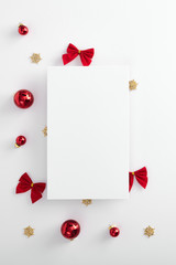Red christmas ball, bow and gold snowflake corner with paper blank