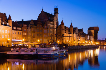Fototapeta na wymiar View on illumination of night embankment of Moltawa River in Gdansk