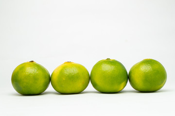 four tangerine on the table