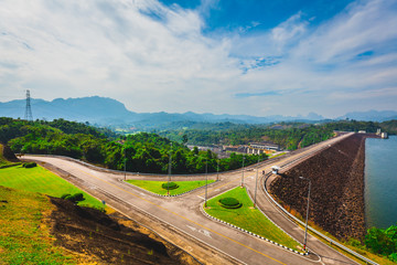 Beautiful Landscape View of Ratchaprapha Dam against Cheow Lan Lake, Mountain, Blue Sky and Clouds at Khao Sok National Park, Thailand