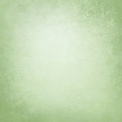 Green background texture, old distressed vintage grunge in faded white center and pastel green border design that is blank with copyspace